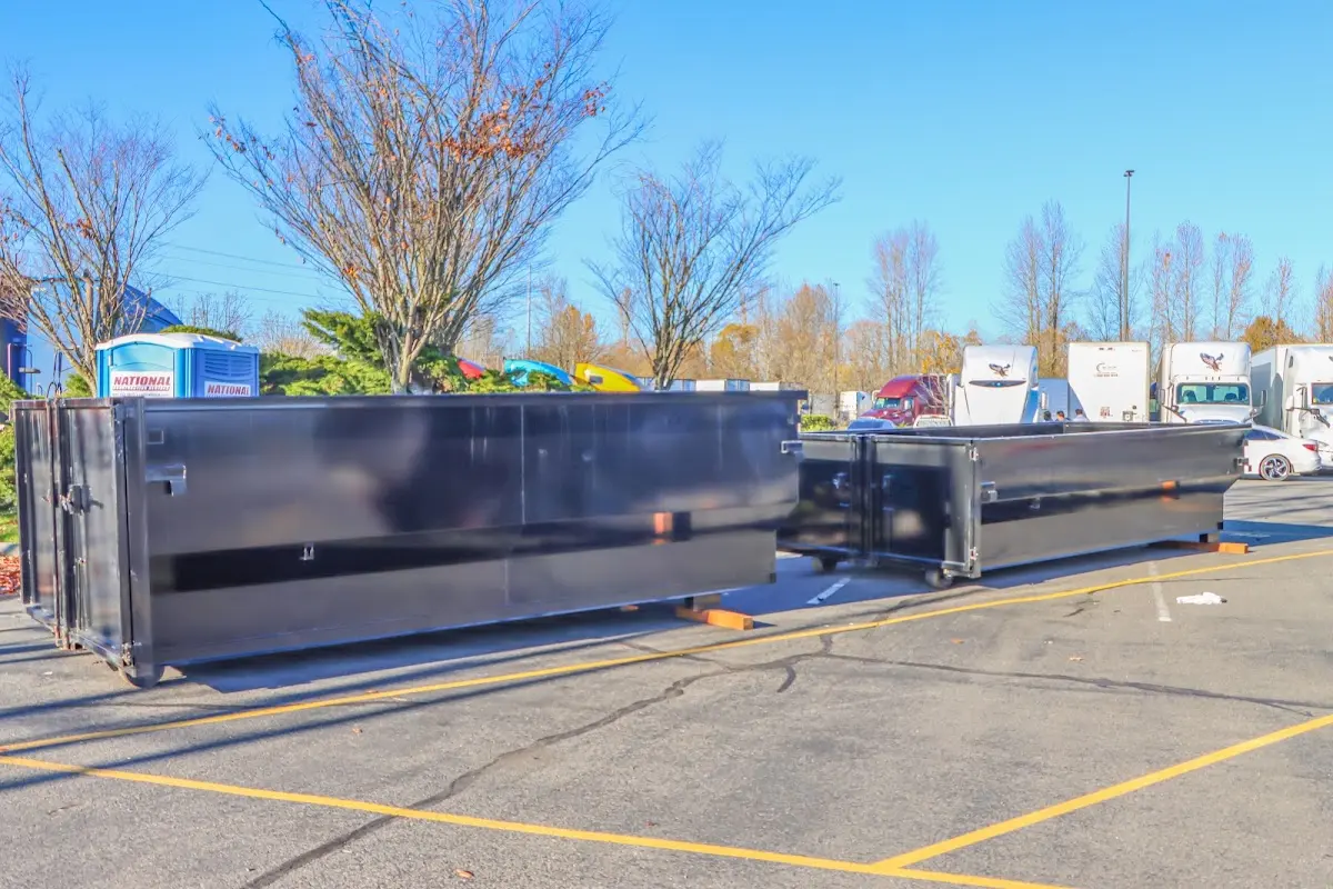 Professional dumpster rental service with roll-off container on residential driveway in Hacienda Heights